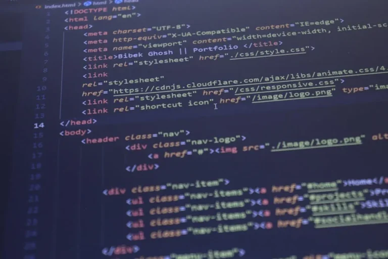 Close-up view of HTML and CSS code displayed on a computer screen, ideal for programming and technology themes.